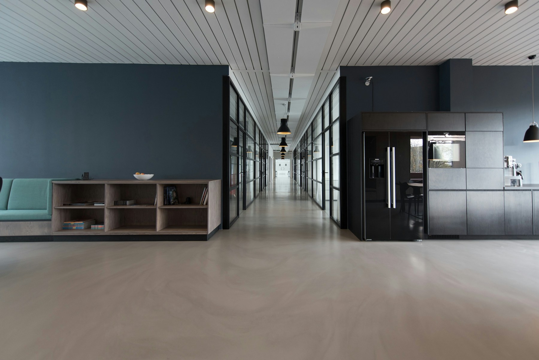 Wide warehouse bay with morning light across concrete floor